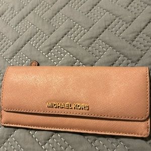 Cute and sleek dusty rose colored wallet.